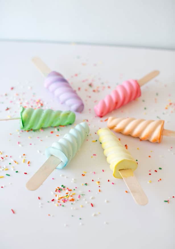 DIY Sidewalk Chalk Popsicles surrounded by sprinkles