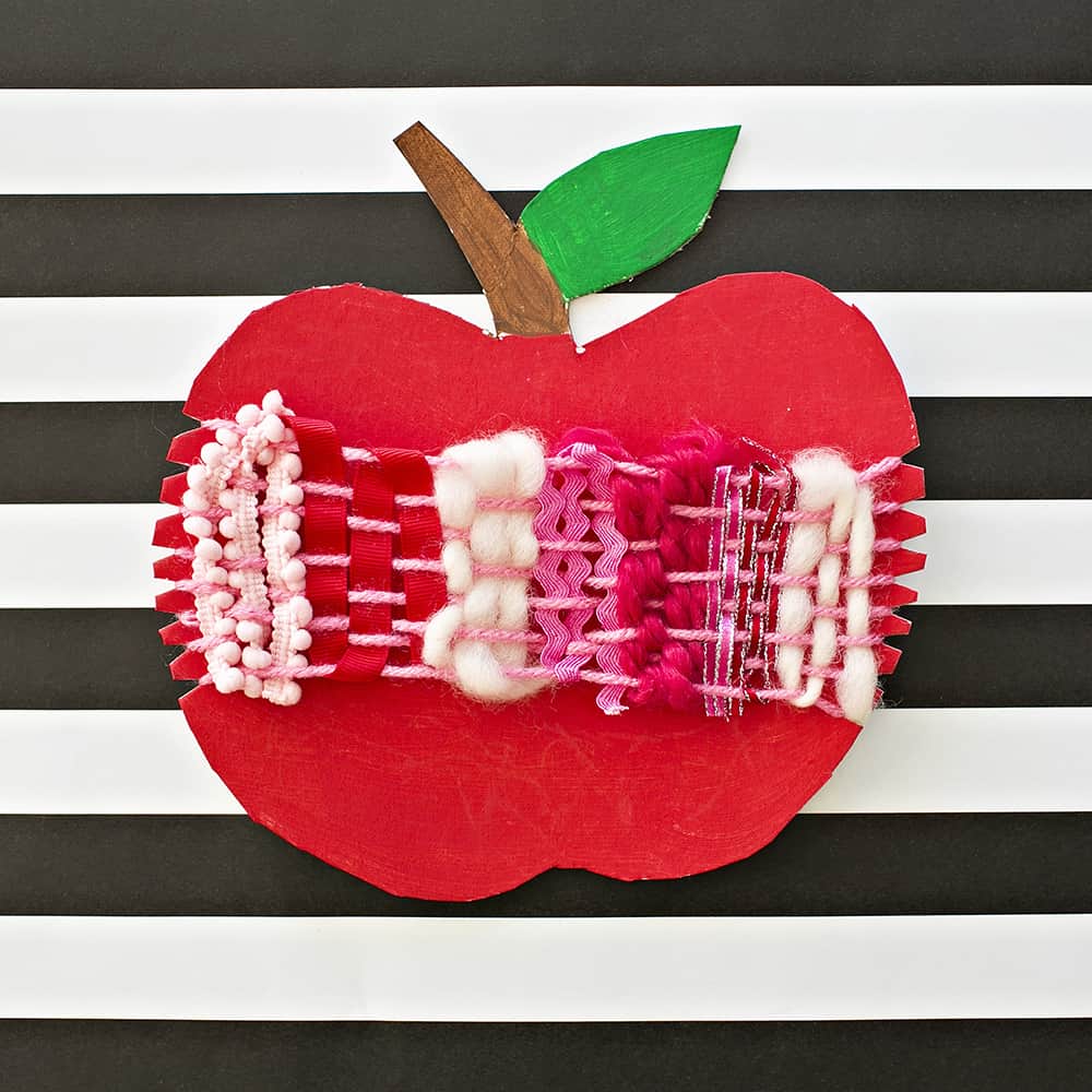 Ring in fall with an artful cardboard apple weaving craft for kids! A wonderful arts and crafts activity and fine motor skill practice. 