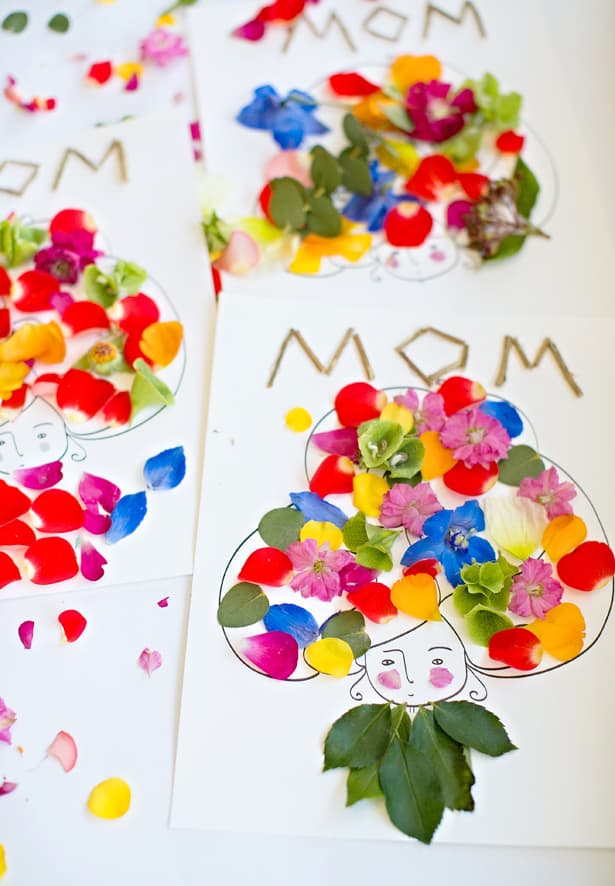 A hand-drawn woman with real flower petals as hair. 