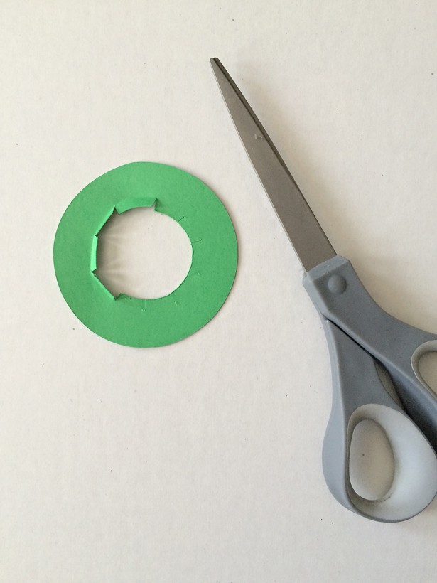 cutting out the parts for the Toilet Tube St. Patrick's Day Leprechaun Hat