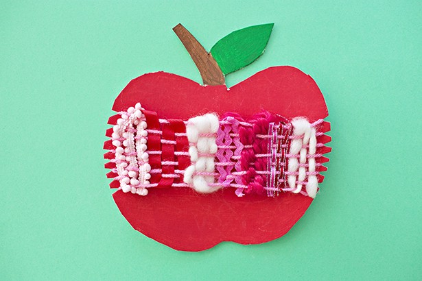 Ring in fall with an artful cardboard apple weaving craft for kids! A wonderful arts and crafts activity and fine motor skill practice. 