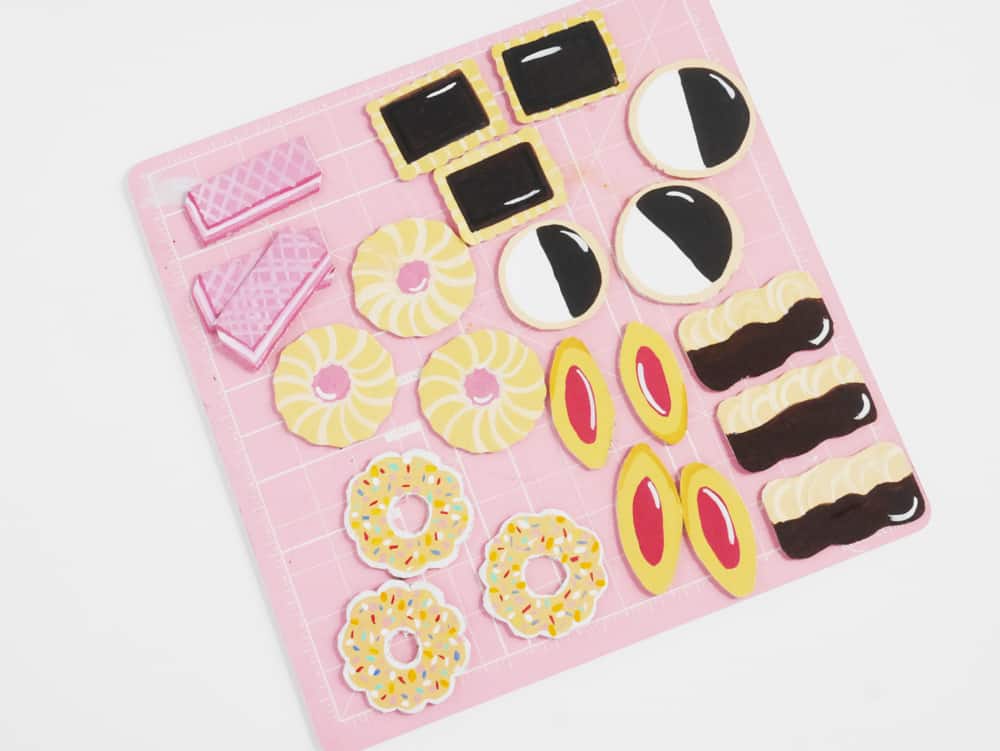 DIY your own set of adorable pretend play cookies from cardboard. A great recycled craft for kids!