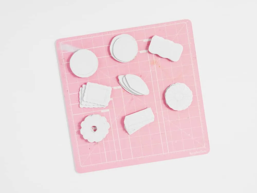 DIY your own set of adorable pretend play cookies from cardboard. A great recycled craft for kids!