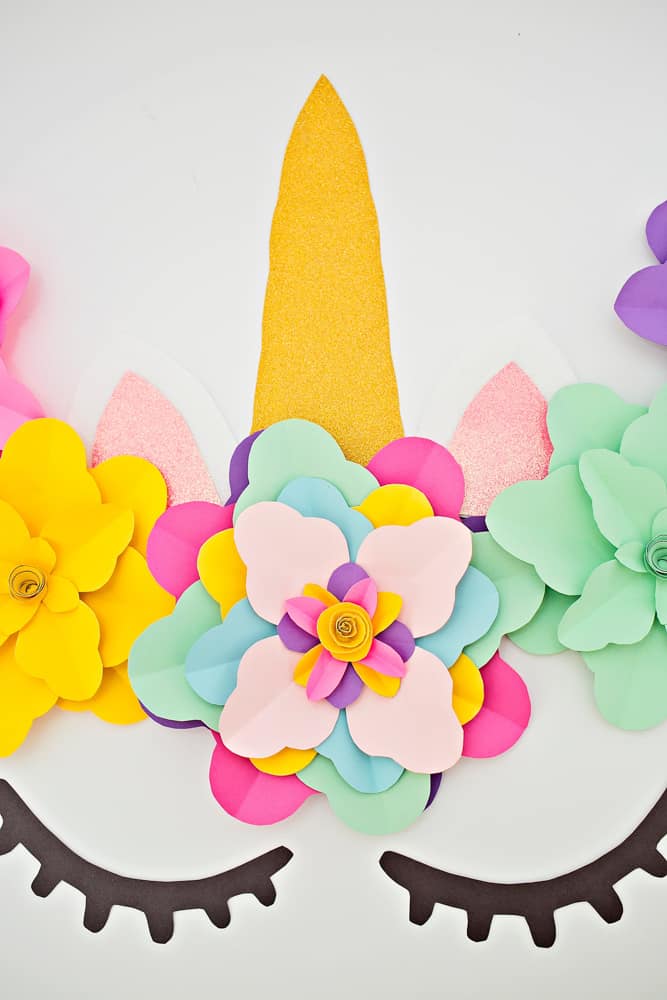 Create a beautiful and easy DIY unicorn flower backdrop for party decor!