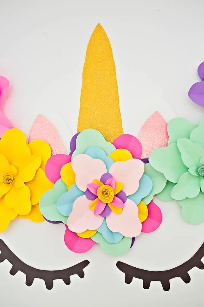 Create a beautiful and easy DIY unicorn flower backdrop for party decor!