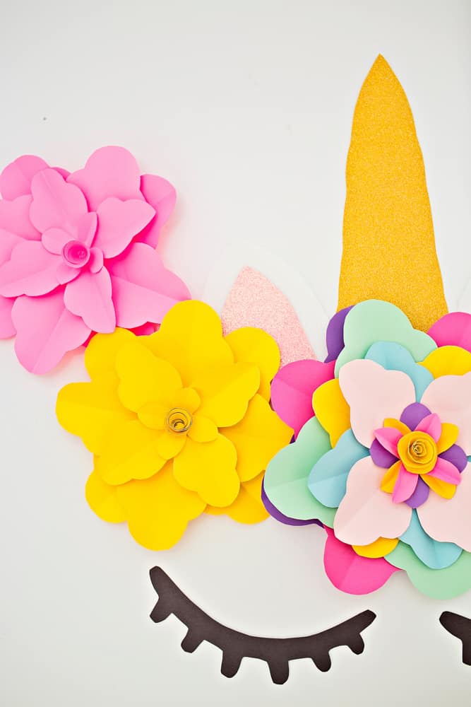 Create a beautiful and easy DIY unicorn flower backdrop for party decor!