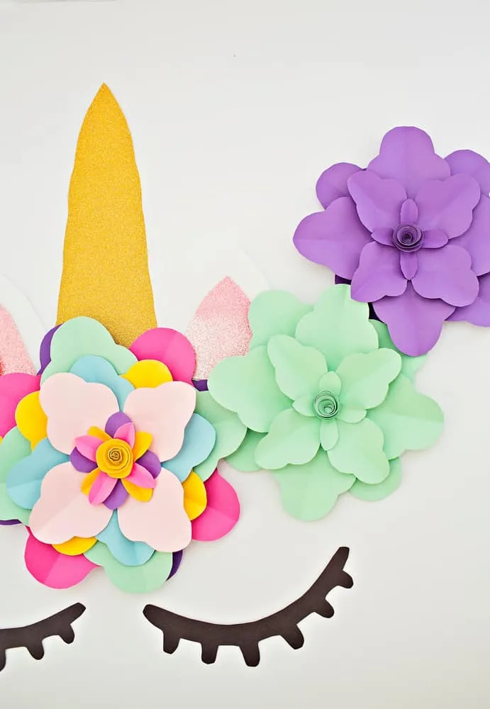 Create a beautiful and easy DIY unicorn flower backdrop for party decor!