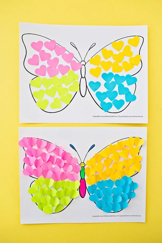 adding on the paper to this BUTTERFLY PAPER HEART CRAFT