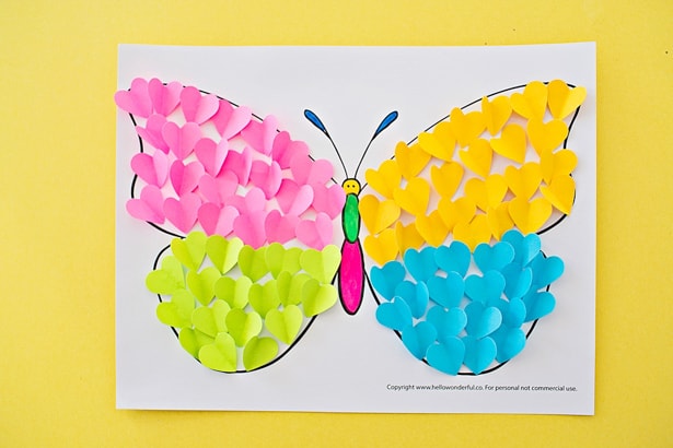 Make a cute summer butterfly craft from cut-out hearts! 