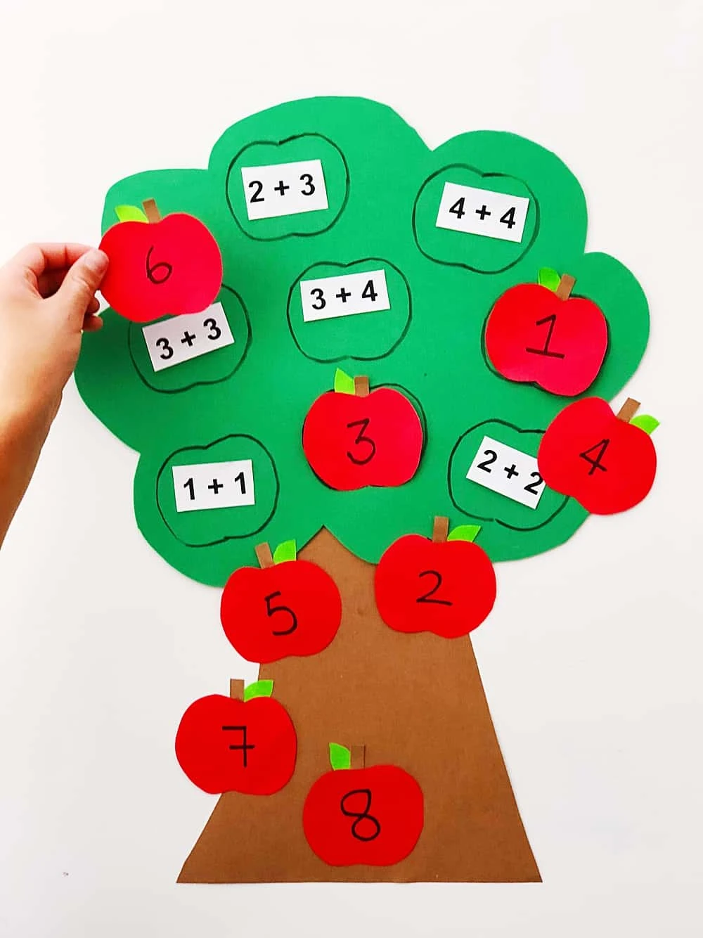 Quickly make this DIY apple math tree learning tool to help make math a game for your kids!