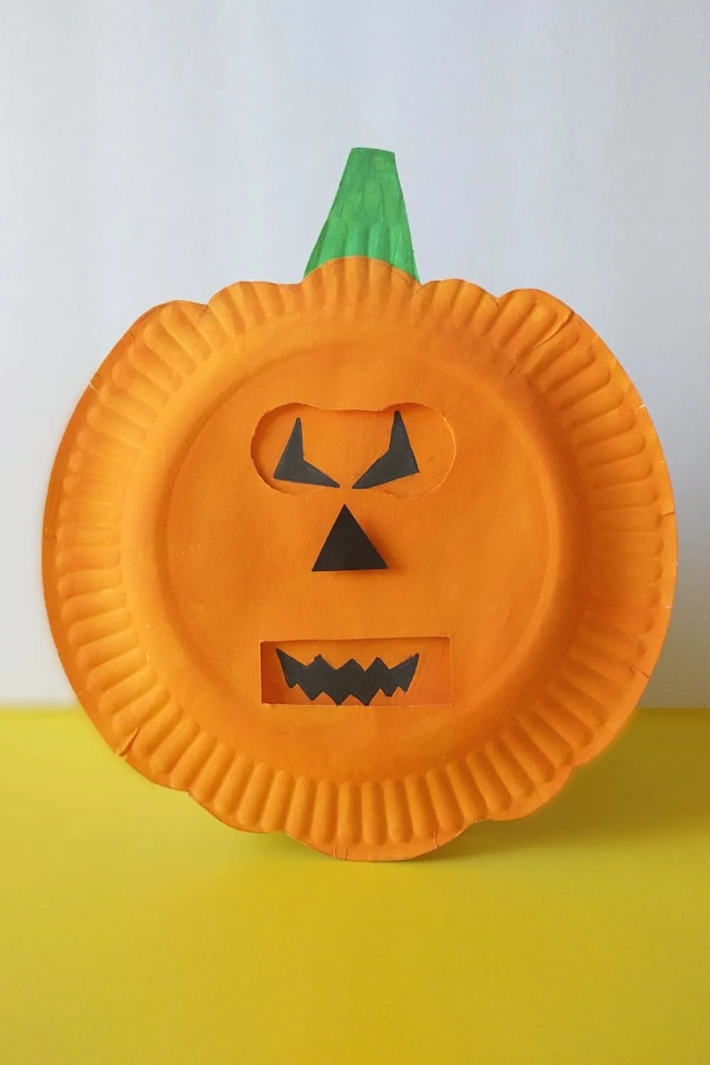 Help kids explore emotions using this simple shapes of jack-o-lantern faces with this fun seaosnal pumpkins emotion craft!