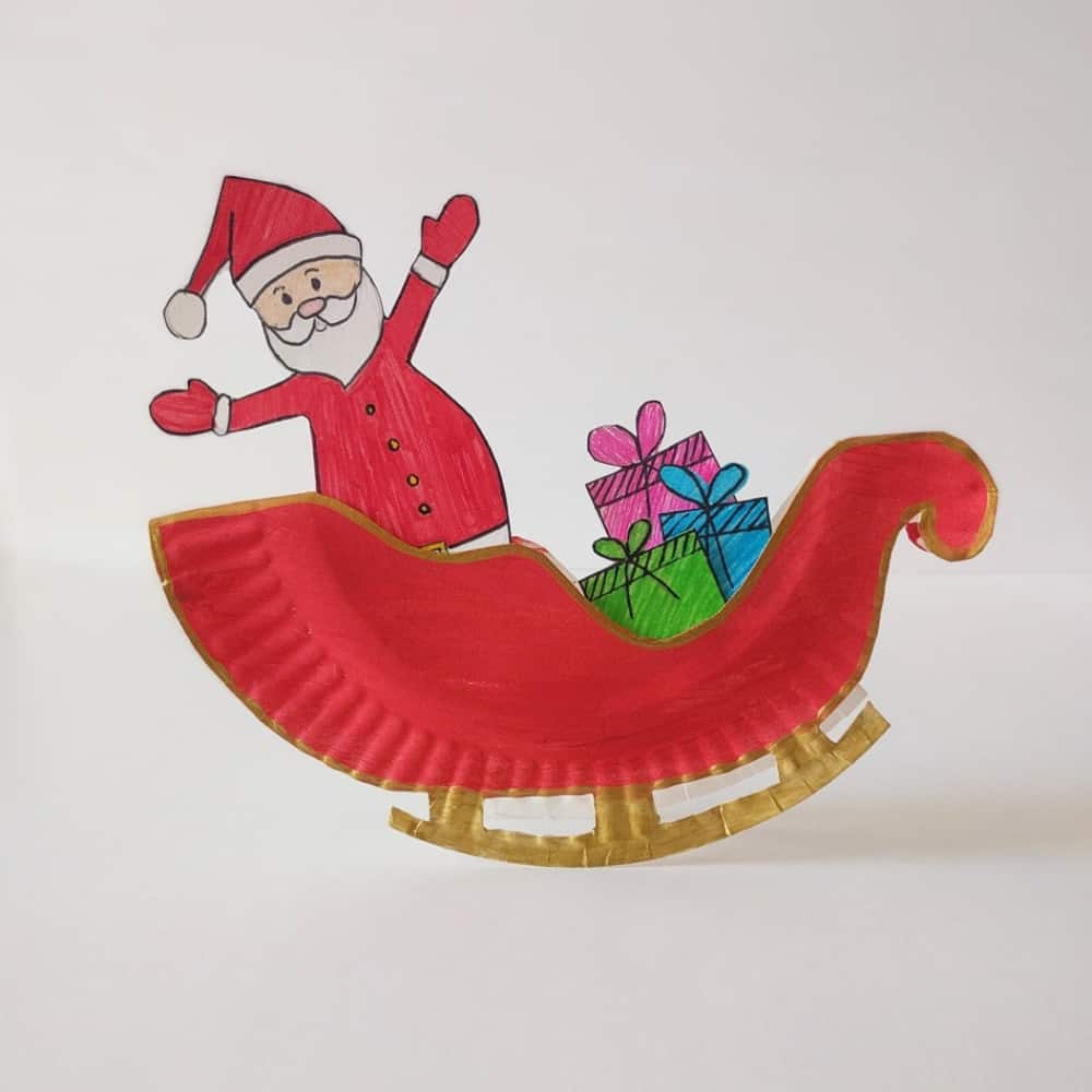 Make a rocking Santa sleigh out of a paper plate! A cute holiday craft for kids via hello, Wonderful.