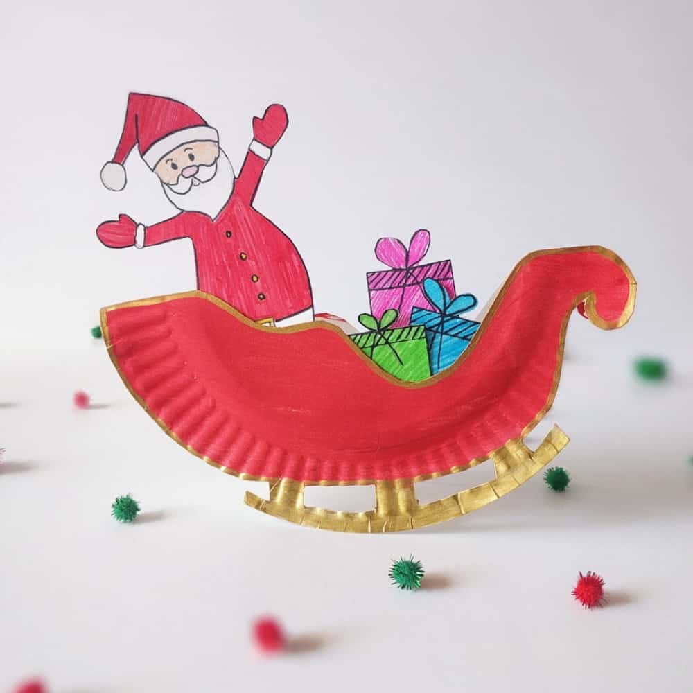 Make a rocking Santa sleigh out of a paper plate! A cute holiday craft for kids via hello, Wonderful.