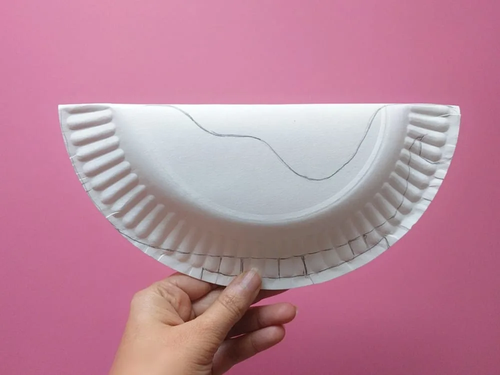 Make a rocking Santa sleigh out of a paper plate! A cute holiday craft for kids via hello, Wonderful.