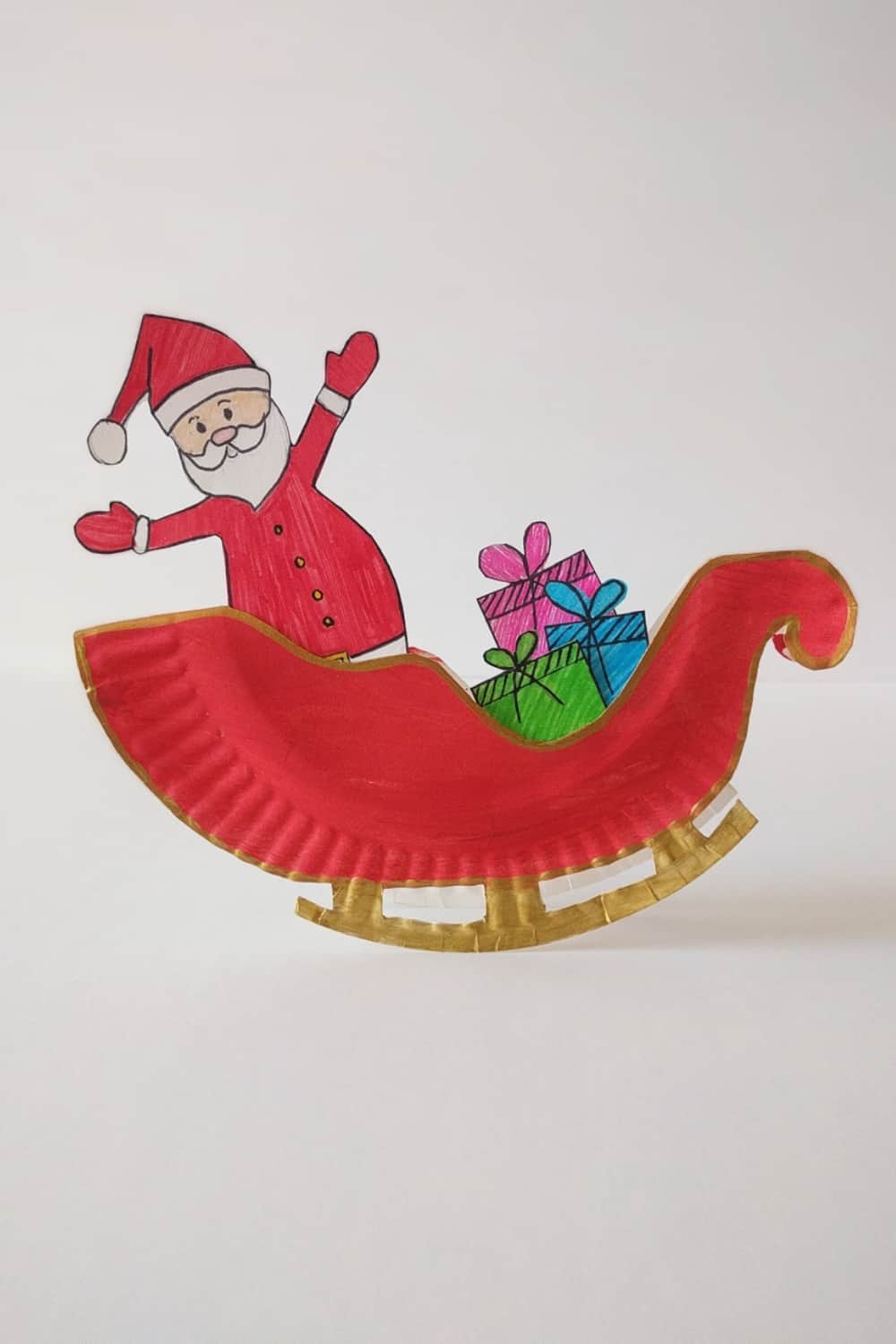 Make a rocking Santa sleigh out of a paper plate! A cute holiday craft for kids via hello, Wonderful.