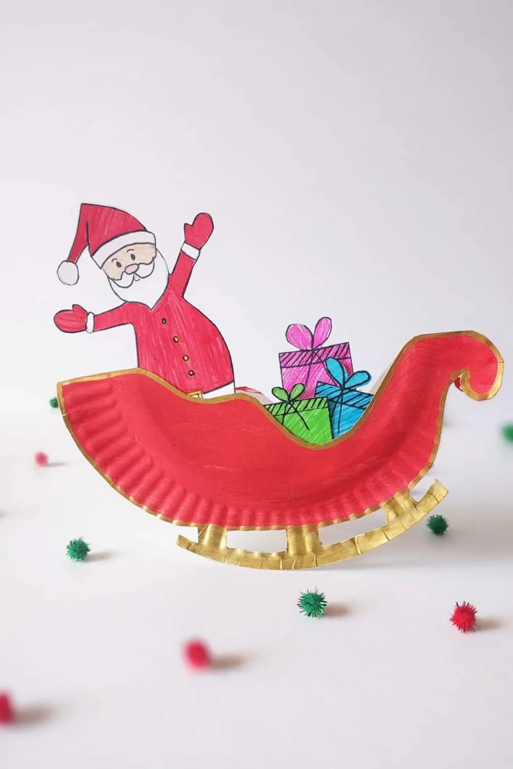 Make a rocking Santa sleigh out of a paper plate! A cute holiday craft for kids via hello, Wonderful.