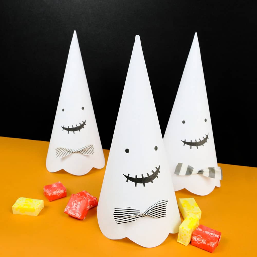 Cute Halloween paper cone ghosts (free template included).