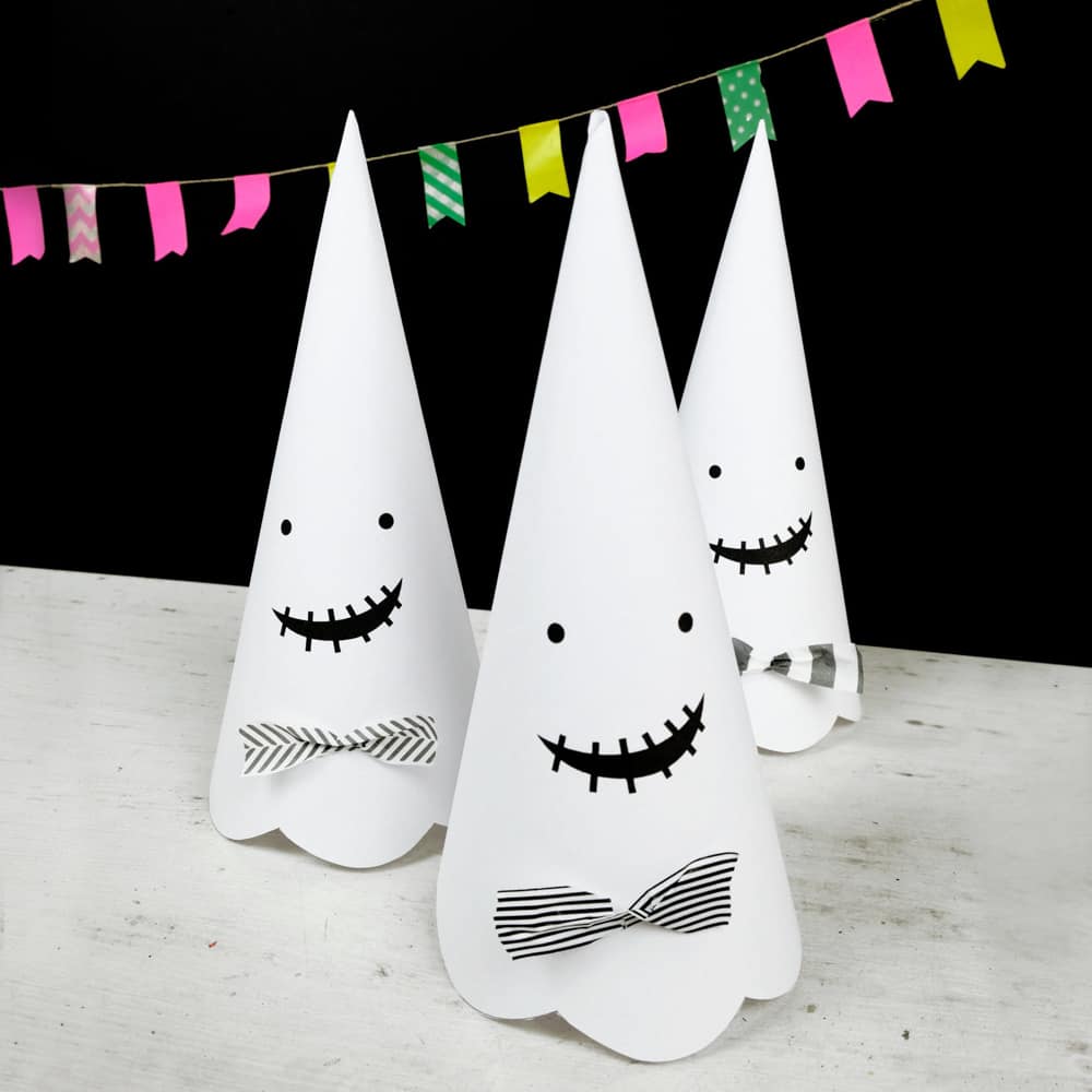 Cute Halloween paper cone ghosts (free template included).