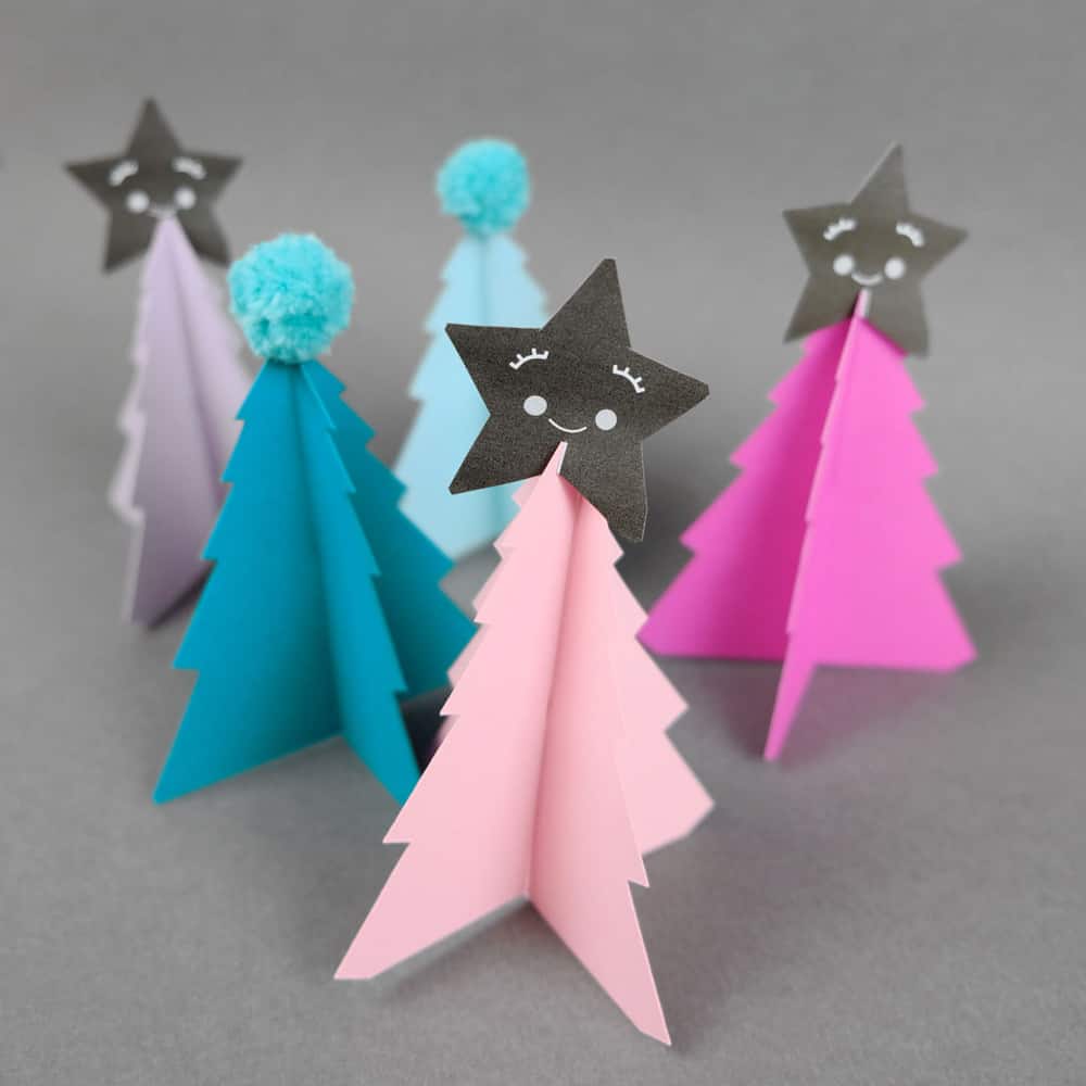 Create your own holiday countdown and use colorful pom poms to decorate these bright trees paper trees (free template included). 