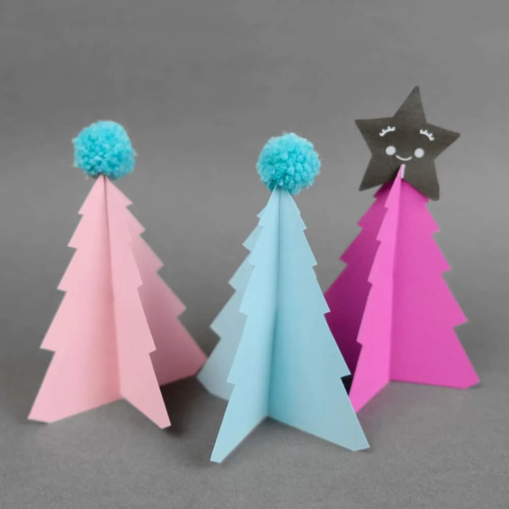 Create your own holiday countdown and use colorful pom poms to decorate these bright trees paper trees (free template included). 