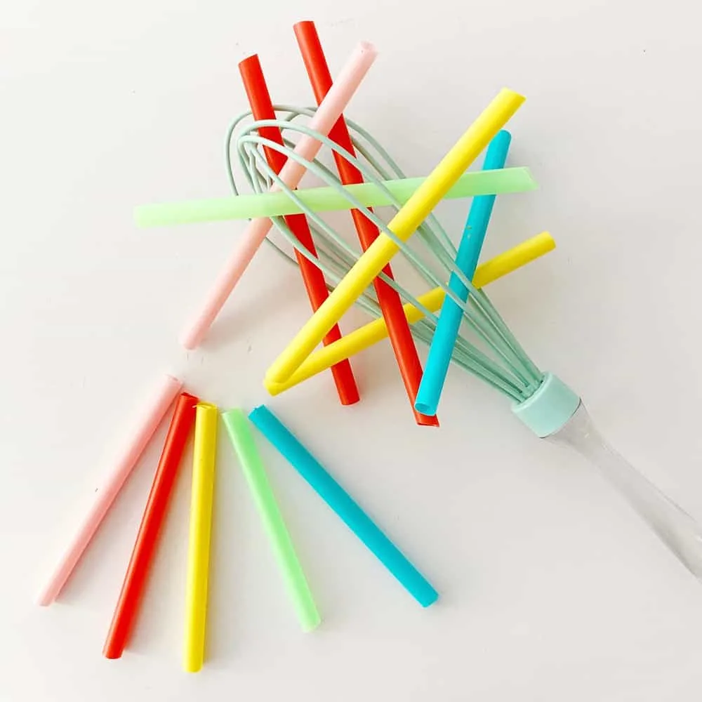 Straw and whisk baby fine motor skills sensory activity. 