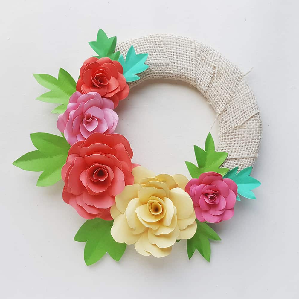 Make a lovely DIY paper rose wreath - perfect for Mother's Day or spring decor!