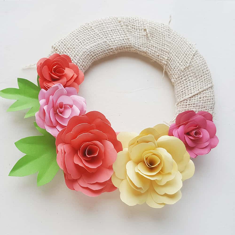 Make a lovely DIY paper rose wreath - perfect for Mother's Day or spring decor!