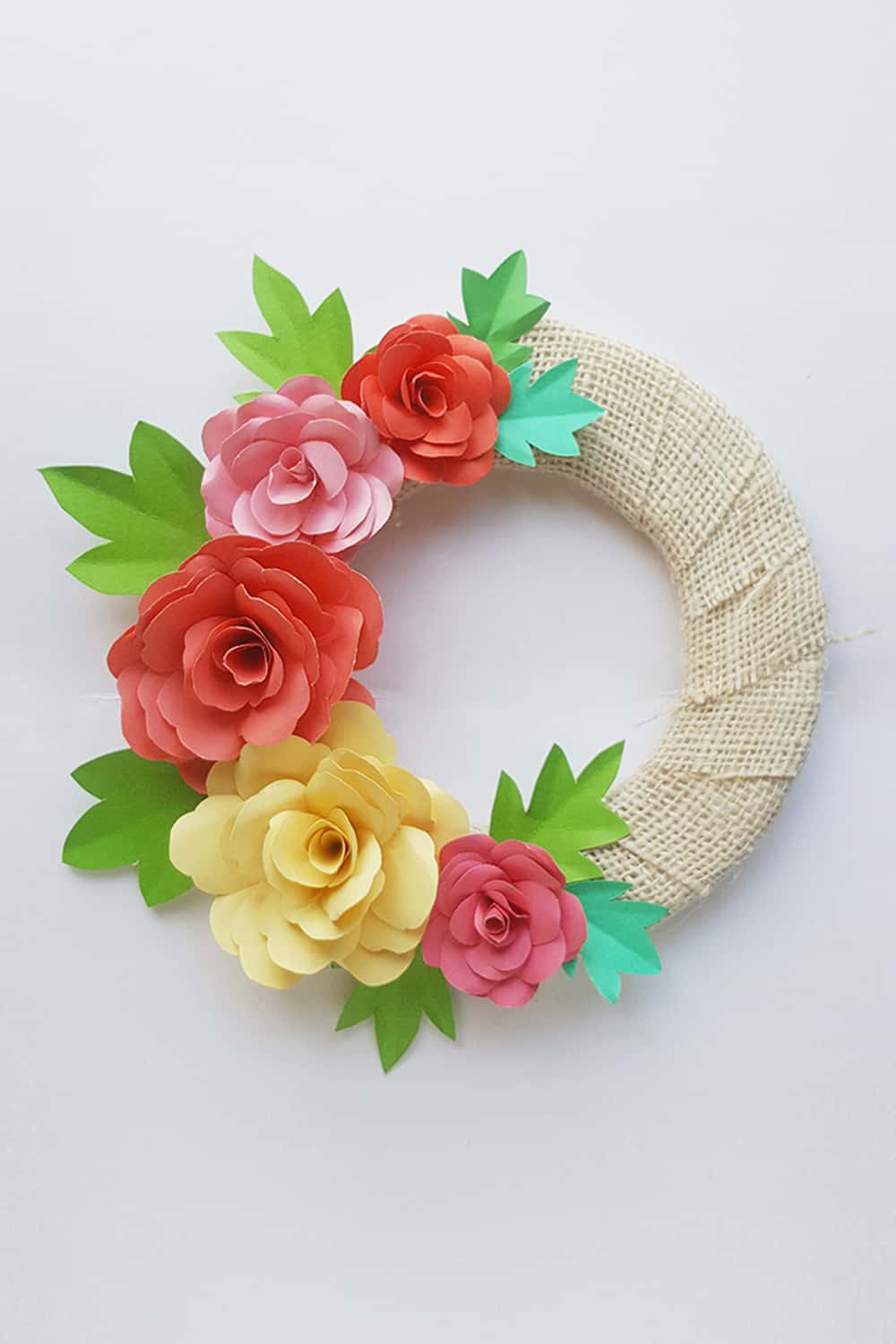 Make a lovely DIY paper rose wreath - perfect for Mother's Day or spring decor!