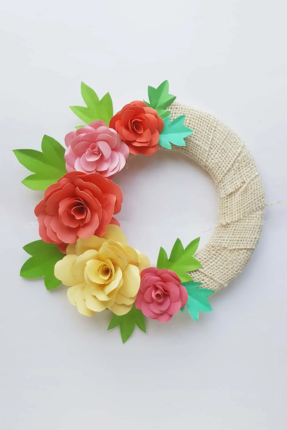 Make a lovely DIY paper rose wreath - perfect for Mother's Day or spring decor!