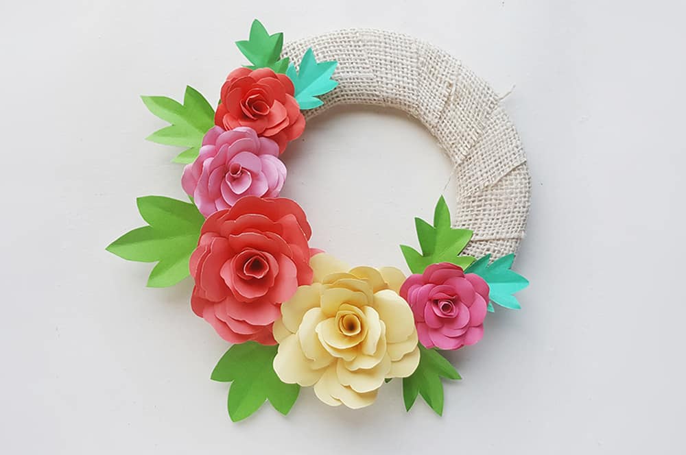 Make a lovely DIY paper rose wreath - perfect for Mother's Day or spring decor!