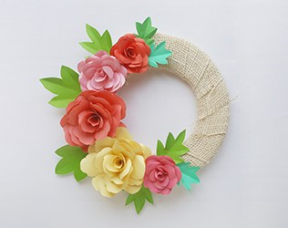 Make a lovely DIY paper rose wreath - perfect for Mother's Day or spring decor!