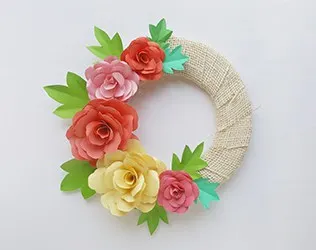 Make a lovely DIY paper rose wreath - perfect for Mother's Day or spring decor!