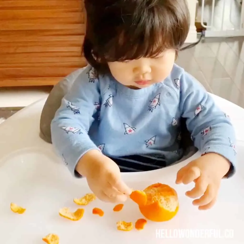 peeling oranges fine motor skills activity for babies or toddlers