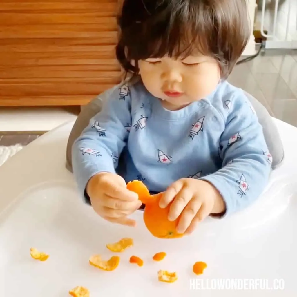 peeling oranges fine motor skills activity for babies or toddlers