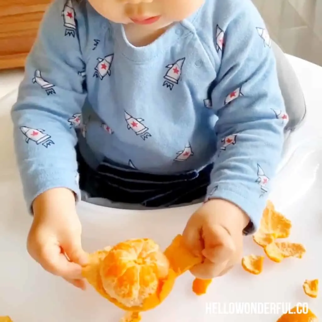 peeling oranges fine motor skills activity for babies or toddlers