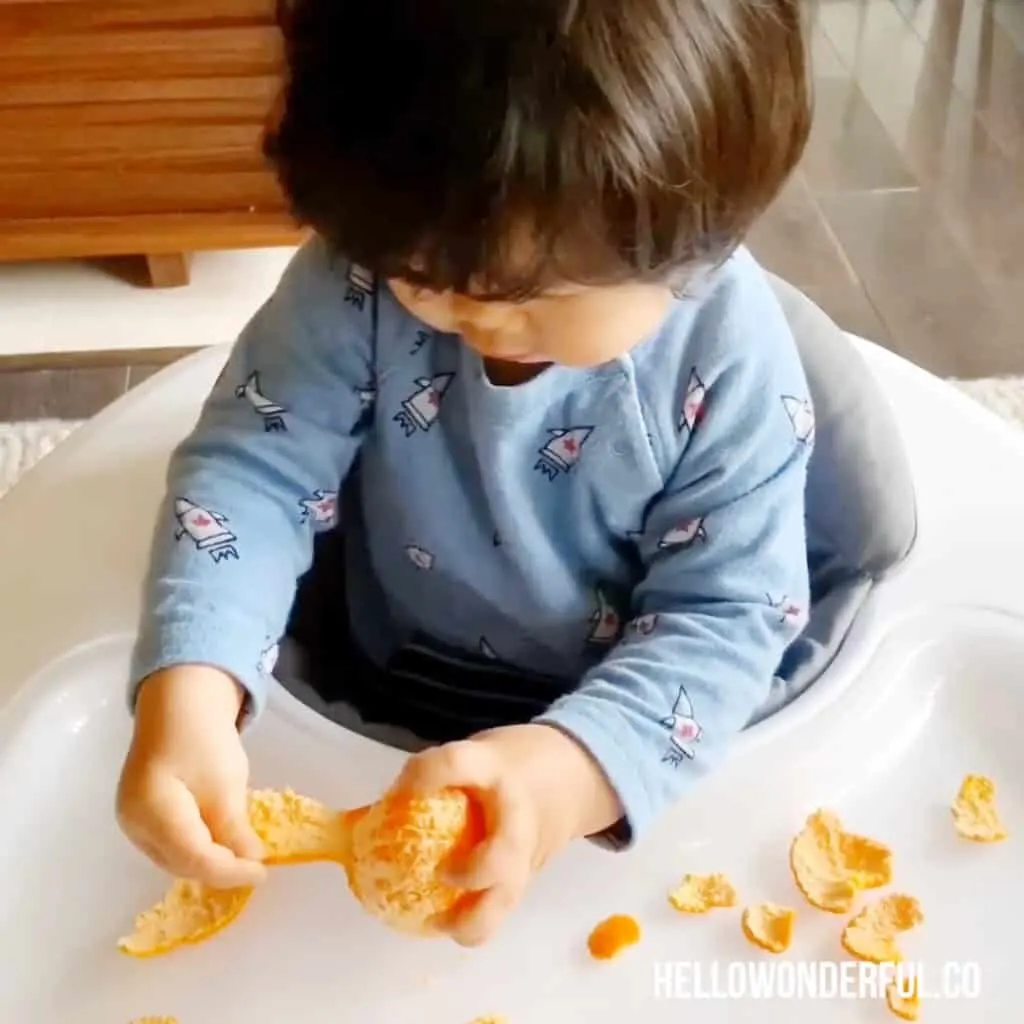 peeling oranges fine motor skills activity for babies or toddlers