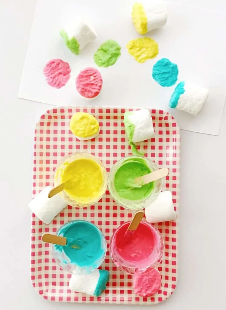 Set up this easy marshmallow stamping with taste safe edible paint. A fun baby or toddler painting activity.