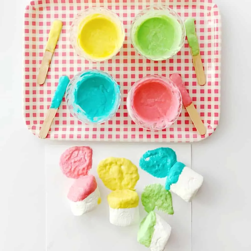 Set up this easy marshmallow stamping with taste safe edible paint. A fun baby or toddler painting activity.