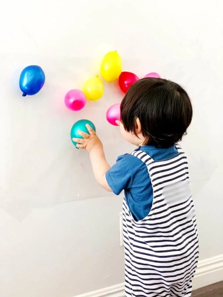 BALLOON STICKY WALL SENSORY ACTIVITY FOR BABIES AND TODDLERS