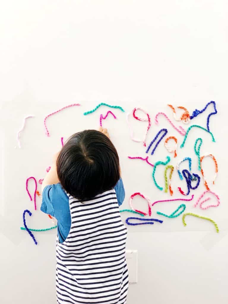 Sticky Wall Yarn Sensory Activity For Babies and Toddlers