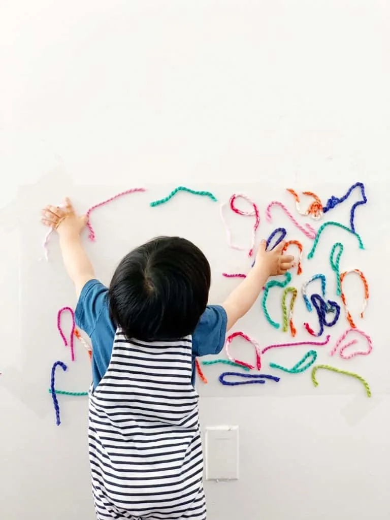 Sticky Wall Yarn Sensory Activity For Babies and Toddlers