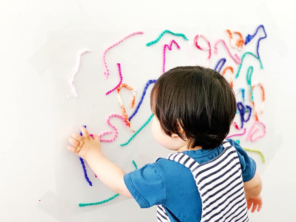 Sticky Wall Yarn Sensory Activity For Babies and Toddlers