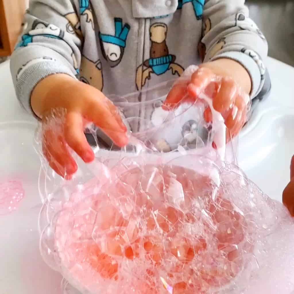 blowing bubbles sensory play for babies and toddlers