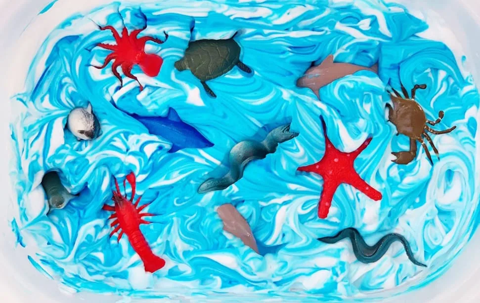 Ocean Sensory Tray with Frozen Rice - The Imagination Tree