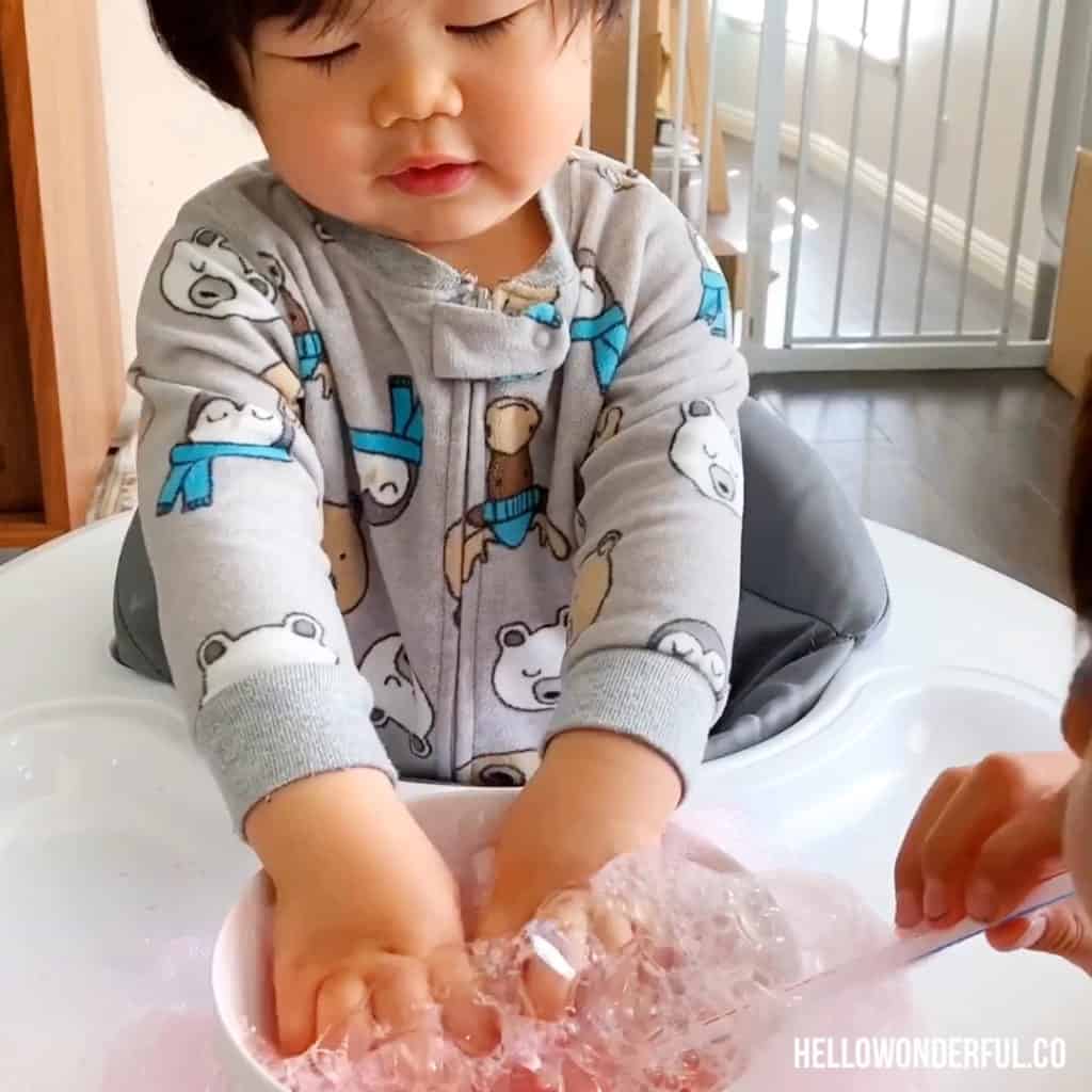 blowing bubbles sensory play for toddlers