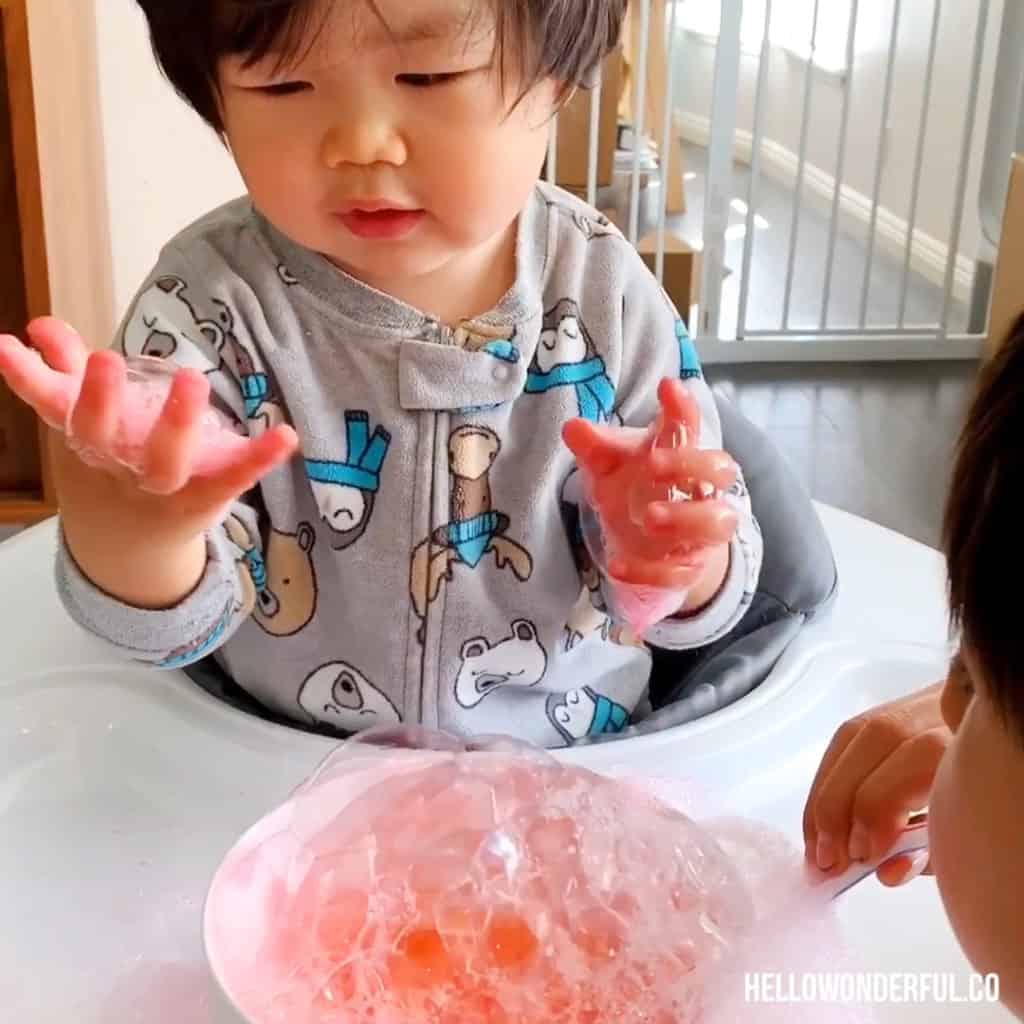 blowing bubbles sensory play for toddlers