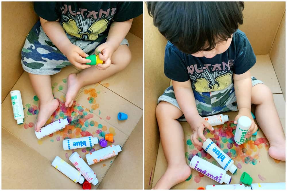 Baby Toddler Painting in a Cardboard Box