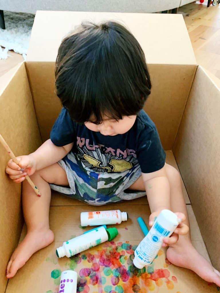 Baby Toddler Painting in a Cardboard Box