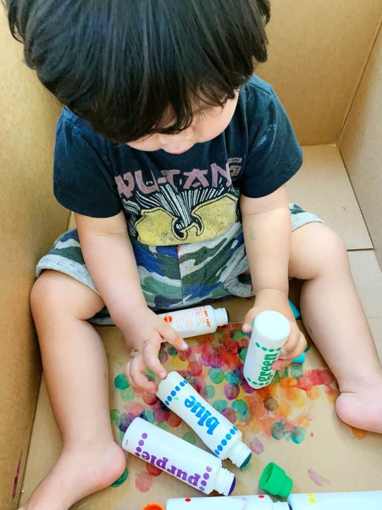 Baby Toddler Painting in a Cardboard Box