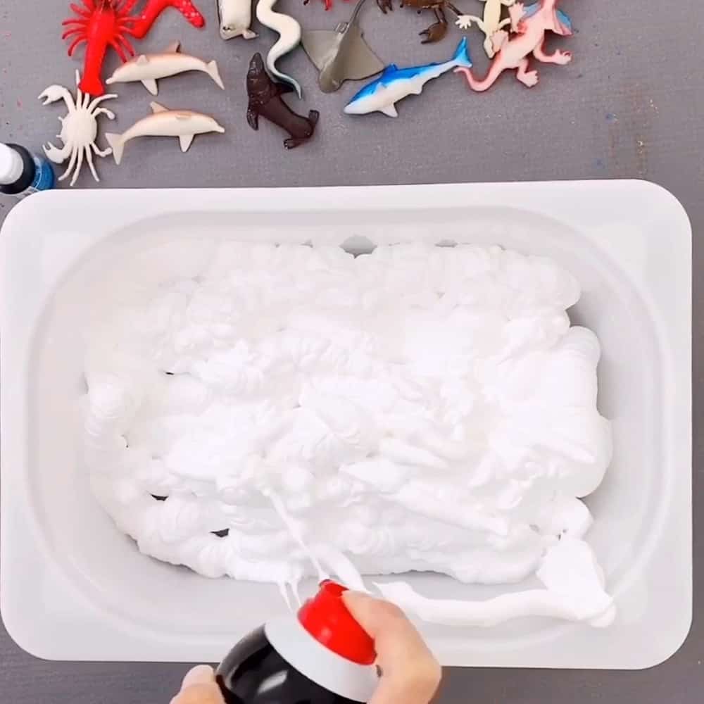 shaving cream in a sensory bin